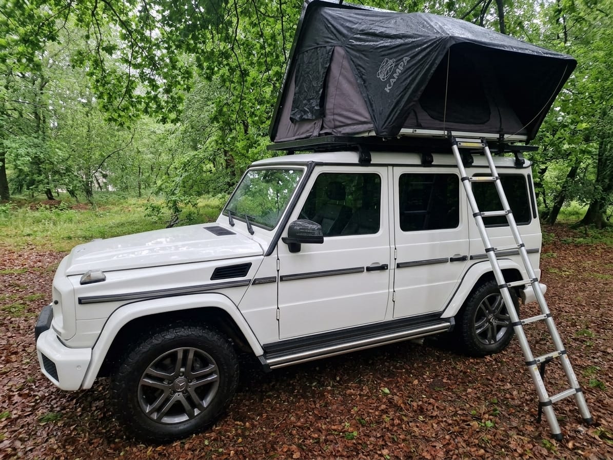 A guest's 4x4 and rooftop tent set up at Misty Campsite
