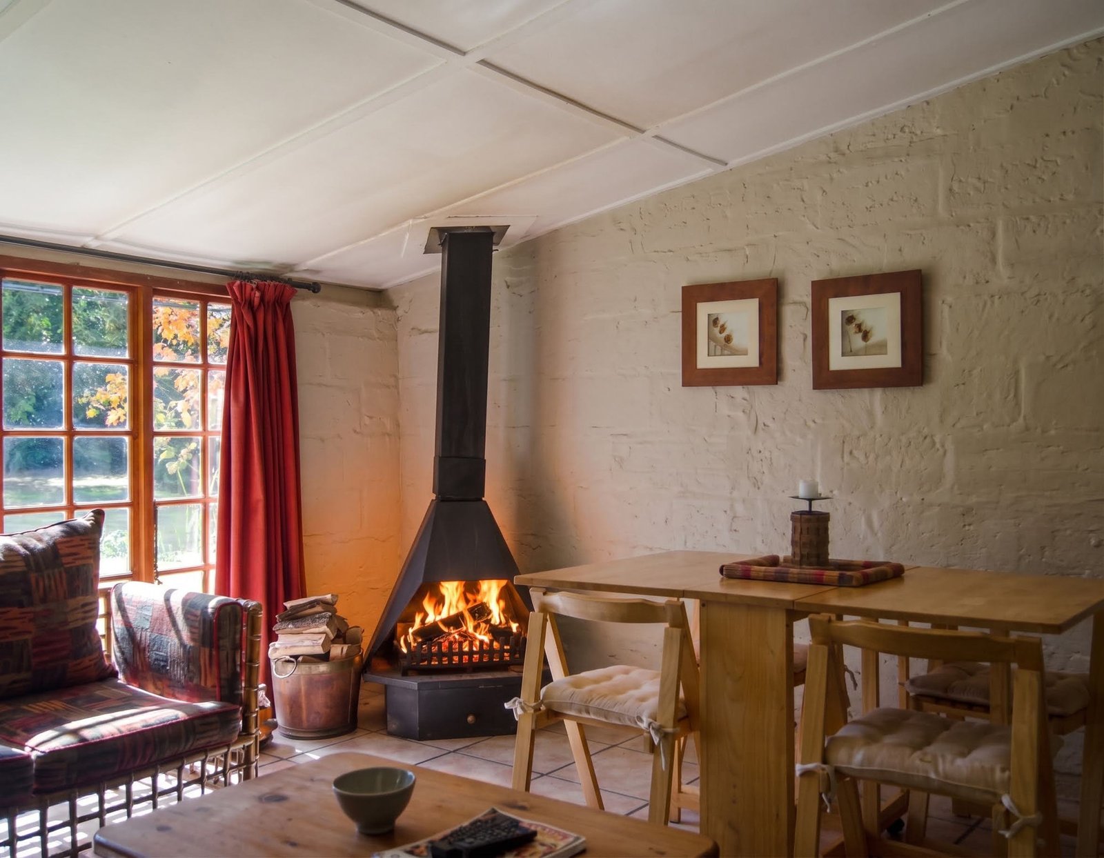 Loerie's sunroom with the dining area and fireplace